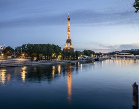 Night view on the river Seine and the Eiffel Tower