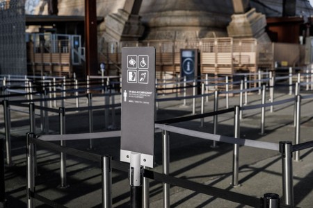 View of signage indicating meeting points for people with disabilities on the forecourt