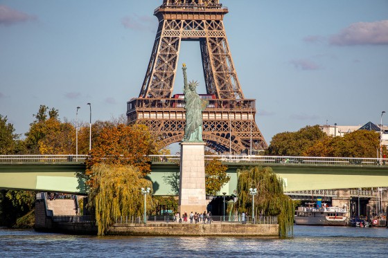 View of the Statue of Liberty in Paris with the Eiffel Tower in the background
